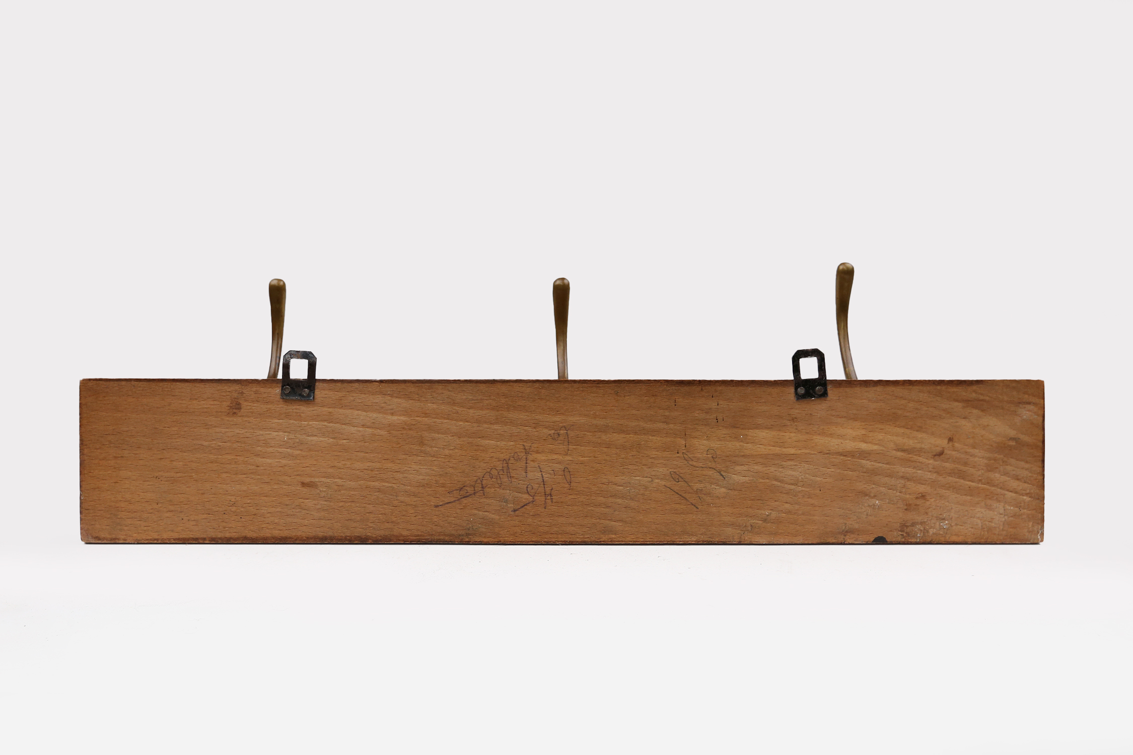 Art Nouveau wall coat rack in carved wood with brass, France ca. 1910thumbnail